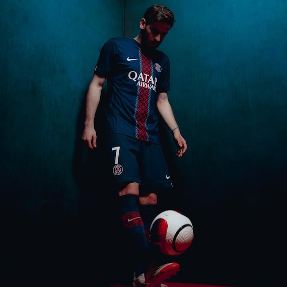 Home Kit 2025-26. More legendary than ever, Paris Saint-Germain’s iconic home kit is reimagined with a midnight blue base, vibrant red and white accents, and a lattice-inspired graphic that pays tribute to the city’s architectural heritage. This design embodies the club’s Parisian identity and legacy.